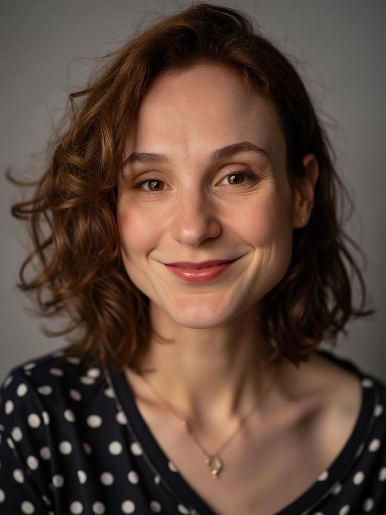 professional studio headshot, soft lighting, looking at camera