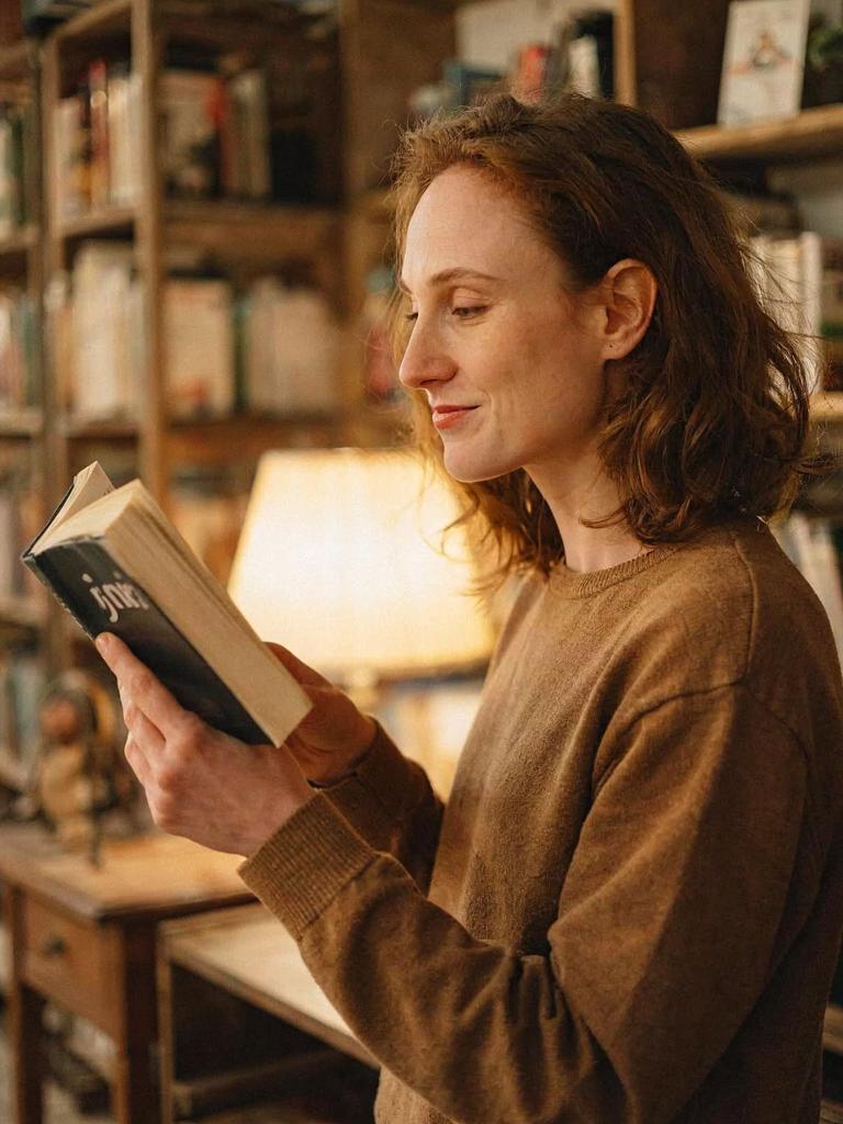 calmly reading a book in a cozy library